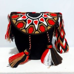 Traditional wayuu crossbody bags with cap .